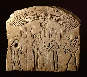 Bas relief stele with an offering scene, a Pharaoh with the goddess Sekhmet and the god Heka